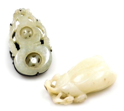 A Chinese white jade carving of a flower, 6.5cm high, together with a jade and white metal paper clip of gourd form, with engraved decoration, 7cm wide. (2)