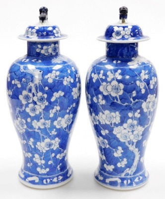 A pair of late 19thC Chinese porcelain baluster vases and covers, each decorated with flowering prunus trees, four character Kangxi mark to underside, 35cm high. - 2