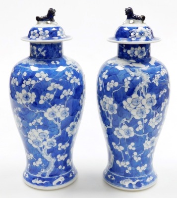 A pair of late 19thC Chinese porcelain baluster vases and covers, each decorated with flowering prunus trees, four character Kangxi mark to underside, 35cm high. - 3