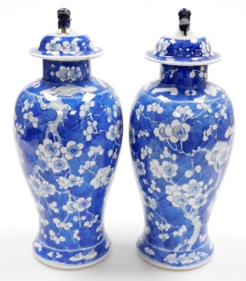 A pair of late 19thC Chinese porcelain baluster vases and covers, each decorated with flowering prunus trees, four character Kangxi mark to underside, 35cm high. - 4