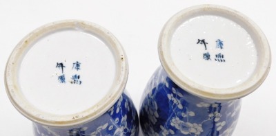 A pair of late 19thC Chinese porcelain baluster vases and covers, each decorated with flowering prunus trees, four character Kangxi mark to underside, 35cm high. - 6