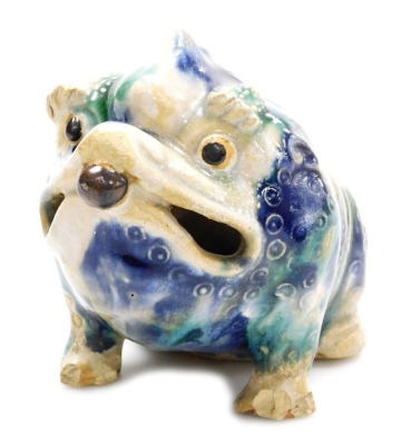 A Chinese pottery vase, modelled in the form of a seated toad, with blue and green mottled glaze, 19cm long.