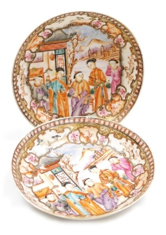 A pair of 18thC Chinese saucers, each decorated with figures in Mandarin palette, unmarked, 12cm diameter.