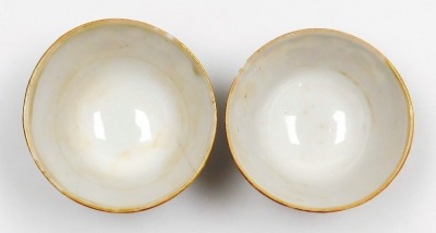 A 19thC Chinese Canton decorated cabaret part tea set, the shaped tray decorated with figures within scroll borders in pink, blue, and green, picked out in gilt, a teapot and two bowls, the tray 27cm diameter. - 14
