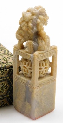 Two similar Chinese porcelain soapstone seals, each with a carved dog of fo finial, in fitted box, and a soapstone and silver coloured metal box and cover, 9cm wide, and a similar box with coloured glass cabochon. (4) - 14