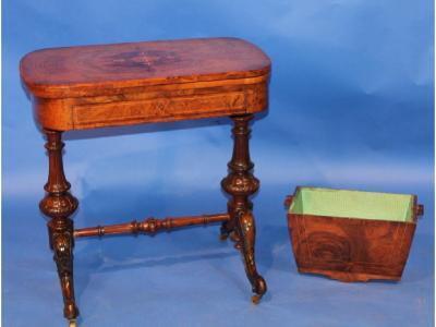 A burr walnut combination games and work table with string inlaid folding games top