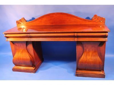 A mahogany early 19thC sideboard with shaped low back