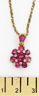 A floral pendant on chain, set with cabachon rutile filled rubies and tiny diamonds on a cabachon ruby and diamond set suspension loop to a bi-colour precious metal chain, 42cm long, 11.2g all in. - 2