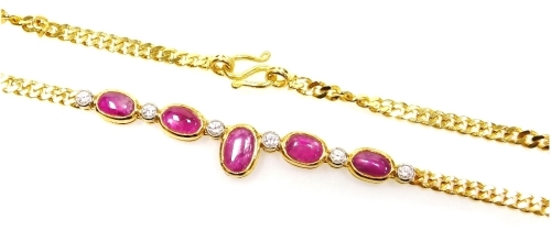 A cabachon ruby set chain necklace, five rubies interset with six tin diamonds to a medium curb link chain, the rubies of 6.2mm - 5.2mm average, 38m long, 12.1g all in.