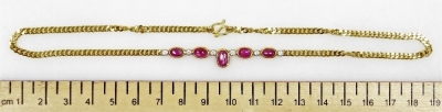 A cabachon ruby set chain necklace, five rubies interset with six tin diamonds to a medium curb link chain, the rubies of 6.2mm - 5.2mm average, 38m long, 12.1g all in. - 2