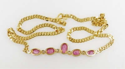 A cabachon ruby set chain necklace, five rubies interset with six tin diamonds to a medium curb link chain, the rubies of 6.2mm - 5.2mm average, 38m long, 12.1g all in. - 3