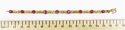 A cabachon ruby set bracelet, nine round rubies of 4mm diameter average, in rub over setting to curb link chain, 16cm long, (very small), 12.2g all in. - 2