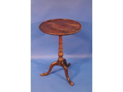 A Victorian walnut tripod table