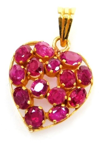 A heart shaped ruby set pendant, fourteen rubies close claw set in precious yellow metal, average stone 2.2mm long, pendant 14mm x 15mm to loop, 2.2g all in.