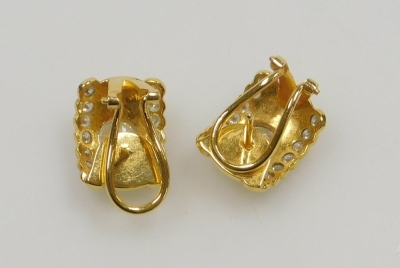 A pair of diamond set clip and post earrings, the central diamonds of 5.5mm diameter each flanked by two rows of seven tiny diamonds, all round brilliant cut, 1.5cm x 1.1cm each, set in precious yellow metal, 8.04g all in. - 3