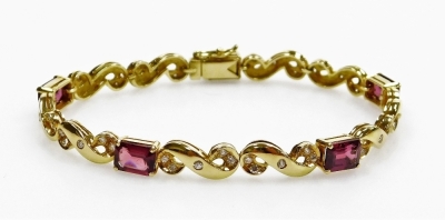 A tourmaline and diamond set articulated bracelet, five rectangular faceted stones of 7.3mm x 5mm average, linked by S scrolls set with tiny diamonds, push clip clasp, 17cm long approx, 14.8g all in, in precious yellow metal.