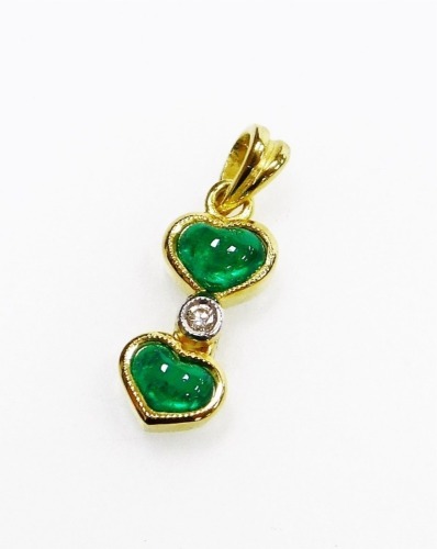 A double heart shaped emerald and diamond pendant, 1cm long, 1.2g all in.