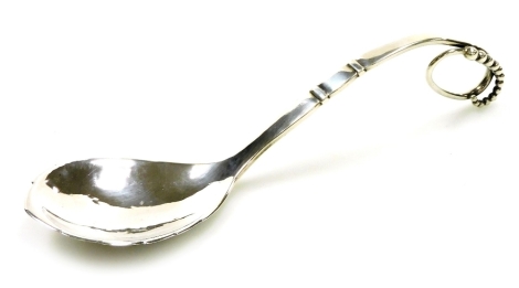 A Georg Jensen silver spoon, pattern 41, with a curved and beaded scrolling handle, impressed marks, Copenhagen marks, 1.83oz.