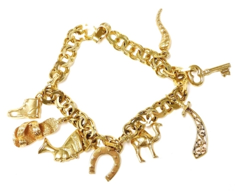 A 14ct gold charm bracelet, with eight charms as fitted, on a snap clasp, 25.3g.