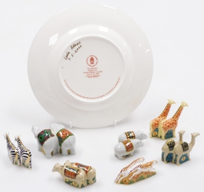 A group of Royal Crown Derby miniature porcelain Noah's Ark animals, comprising elephants, giraffes, cheetahs, camels, zebras, hippos, and water buffalo, 6cm high, five boxed, and a Noah's Arc plate, commissioned by Sinclair's, limited edition number 153/ - 2