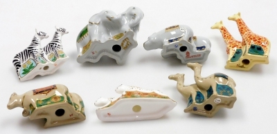 A group of Royal Crown Derby miniature porcelain Noah's Ark animals, comprising elephants, giraffes, cheetahs, camels, zebras, hippos, and water buffalo, 6cm high, five boxed, and a Noah's Arc plate, commissioned by Sinclair's, limited edition number 153/ - 3