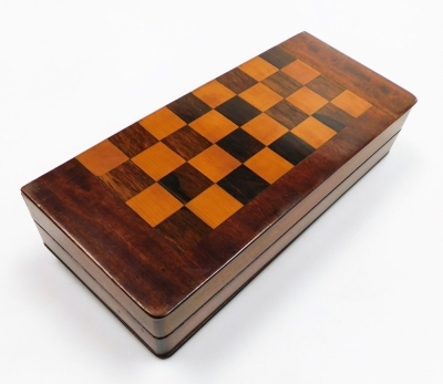 A Victorian mahogany campaign games table, with a rosewood and satinwood chess board top, the box opening to reveal a hexagonal table column and three folding tripod legs, 39cm wide, 16.5cm deep. - 4