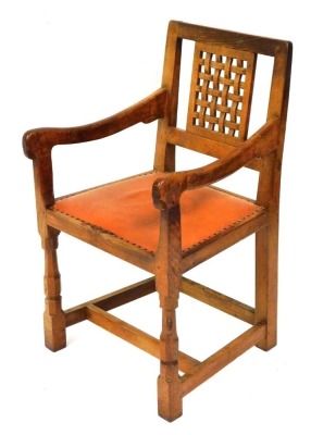 A Robert Thompson Mouseman oak carver chair, with lattice work panel back, a studded leather seat, on octagonal carved and block supports united by a H stretcher, post 1937, model number CH040, 89cm high.  NB. We have specific vendor instructions to SELL WITHOUT RESERVE.