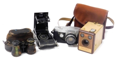 An Olympus pen-f camera, with 1..18 f=38mm lens, number 129037, an Agfa Coronet camera, Kodak Brownie Flash IV camera, cased, and a pair of opera glasses, cased. (4)