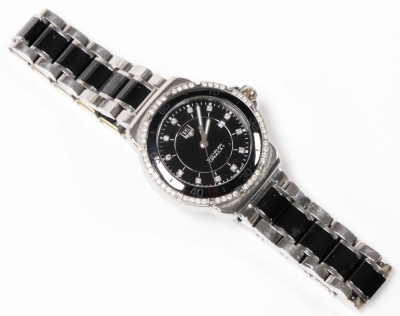 A Tag Heuer Formula 1 diamond set lady's wristwatch, circular black dial with diamonds at intervals, centre seconds, date aperture, diamond set bezel, case back engraved WA81312/RPL3291, on a bicolour bracelet strap. - 2