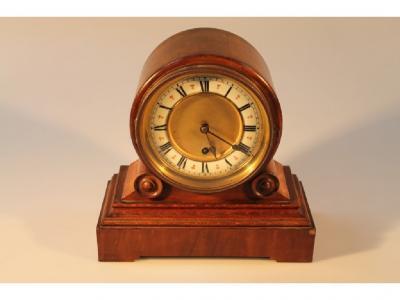 A Victorian walnut mantel clock