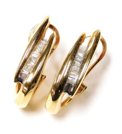 A pair of bicolour and diamond set earrings, baguette cut in a channel setting, in yellow metal, 6.5g.