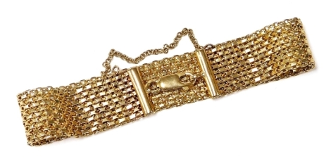 A 9ct gold mesh bracelet, on a lobster claw clasp, with safety chain as fitted, 15.9g.