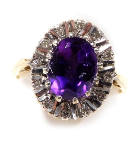 A 9ct gold amethyst and diamond ring, in an oval setting, size L/M, 3.4g.