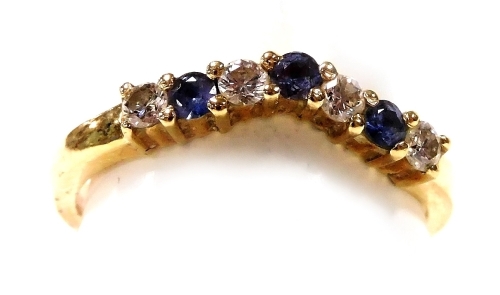 A 14ct gold sapphire and diamond seven stone wishbone eternity ring, size N, 2.8g.