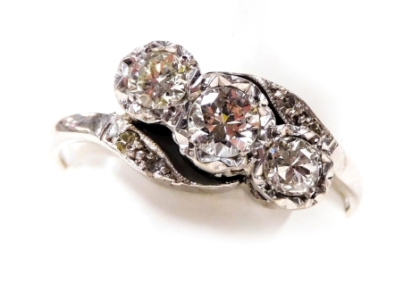 An 18ct white gold and diamond three stone ring, with diamond set shoulders, approx 1ct, size Q, 3.7g.