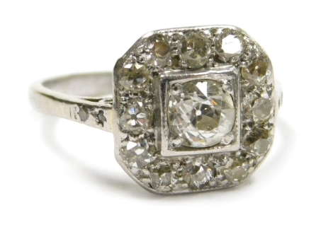 An Art Deco diamond ring, set with old cut diamonds in a cushion setting, in white metal stamped Plat, approx 1ct, size K, 3.4g.