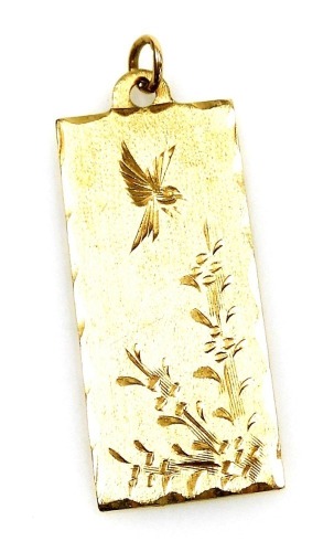 A 9ct gold pendant, of rectangular form, engraved with a hovering bird and flowers, 5.2g.