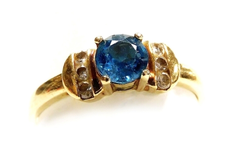 A 9ct gold and aquamarine ring, with diamond set shoulders, size P, 1.8g all in.