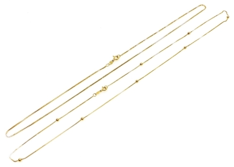 An 18ct gold cable link neck chain, on a bolt ring clasp, and a further neck chain set with gold beads at intervals, on a bolt ring clasp, 9.0g.