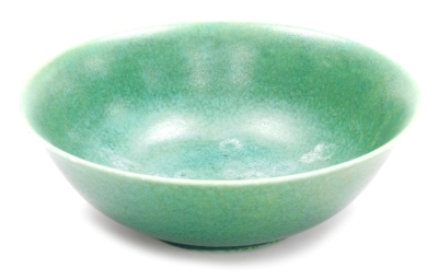 A Pilkington Royal Lancastrian pottery bowl, in a mottled green glaze, impressed marks and numbered 2524, 23cm diameter.