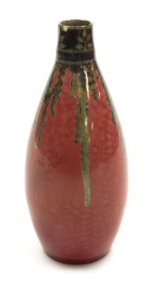 A Pilkington Royal Lancastrian pink and silver lustre pottery vase, of elongated cylindrical form, impressed marks and numbered 2564, 18.5cm high. (AF)