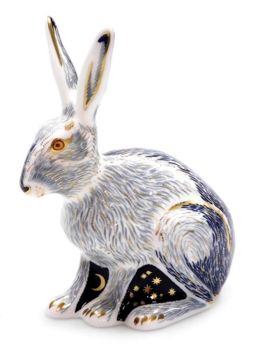 A Royal Crown Derby porcelain Starlight Hare paperweight, an exclusive for the Royal Crown Derby Collector's Guild, gold stopper and red printed marks, 12cm high, boxed.