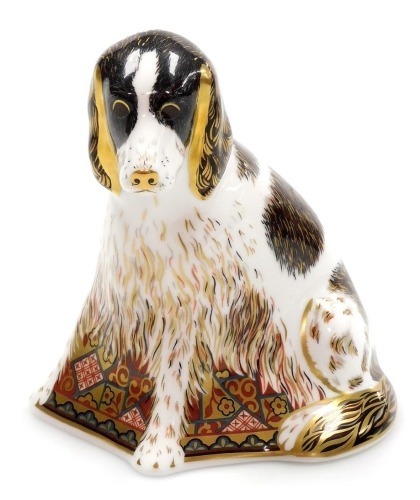 A Royal Crown Derby porcelain Molly paperweight, an exclusive for the Royal Crown Derby Collector's Guild, gold stopper and red printed marks, 12cm high, boxed.