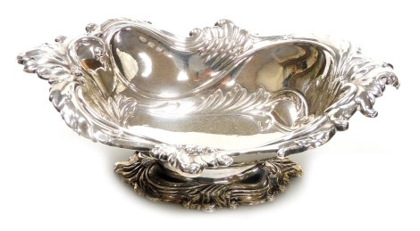 A Victorian silver pedestal dish, repousse decorated with scrolls and leaves, Birmingham 1896, 3.22oz, 17cm wide.