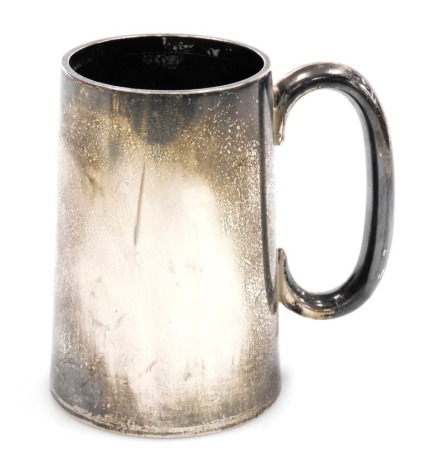 A George V silver mug, of plain tapered form, H Phillips, London 1925, 14.03oz, 12.5cm high.