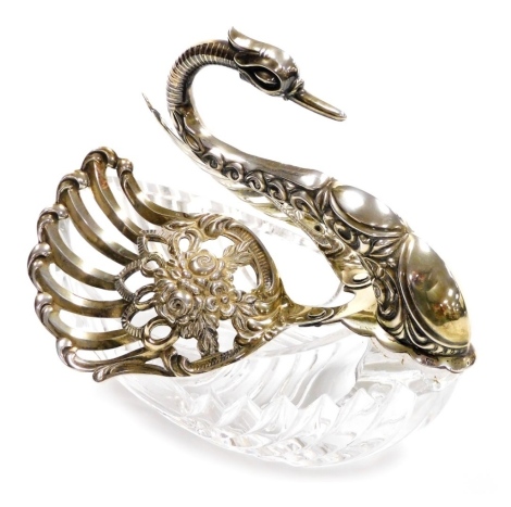 A cut glass and silver mounted butter dish in the form of a swan, the swan and feather stamped 925, 15cm high.