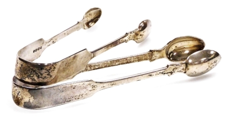 A pair of Victorian silver sugar tongs, London 1837, 15cm long, and another similar, London 1853, 13.5cm long, 2.96oz.