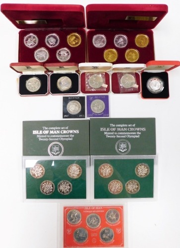 A group of Isle of Man commemorative coinage, two complete sets of Isle of Man crowns, 1979 coin sets, commemorative crowns, etc.