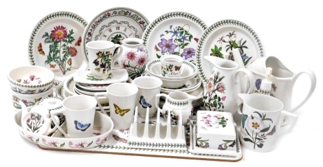 A group of Portmeirion Pottery, including a watering can, soap dispenser, wall clock, plates, bowls, preserve pot and cover, toast rack and butter dish and cover. (a quantity)