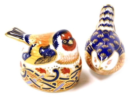 A Royal Crown Derby imari paperweight modelled as a gold finch nesting, and another modelled as a wren. (2)